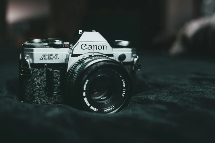 black and silver canon dslr camera